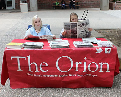 Members of The Orion are tabling